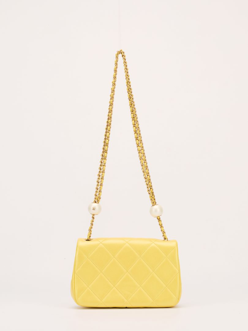 Iridescent Yellow Lambskin Quilted Mini Pearl Crush Flap Bag With GHW